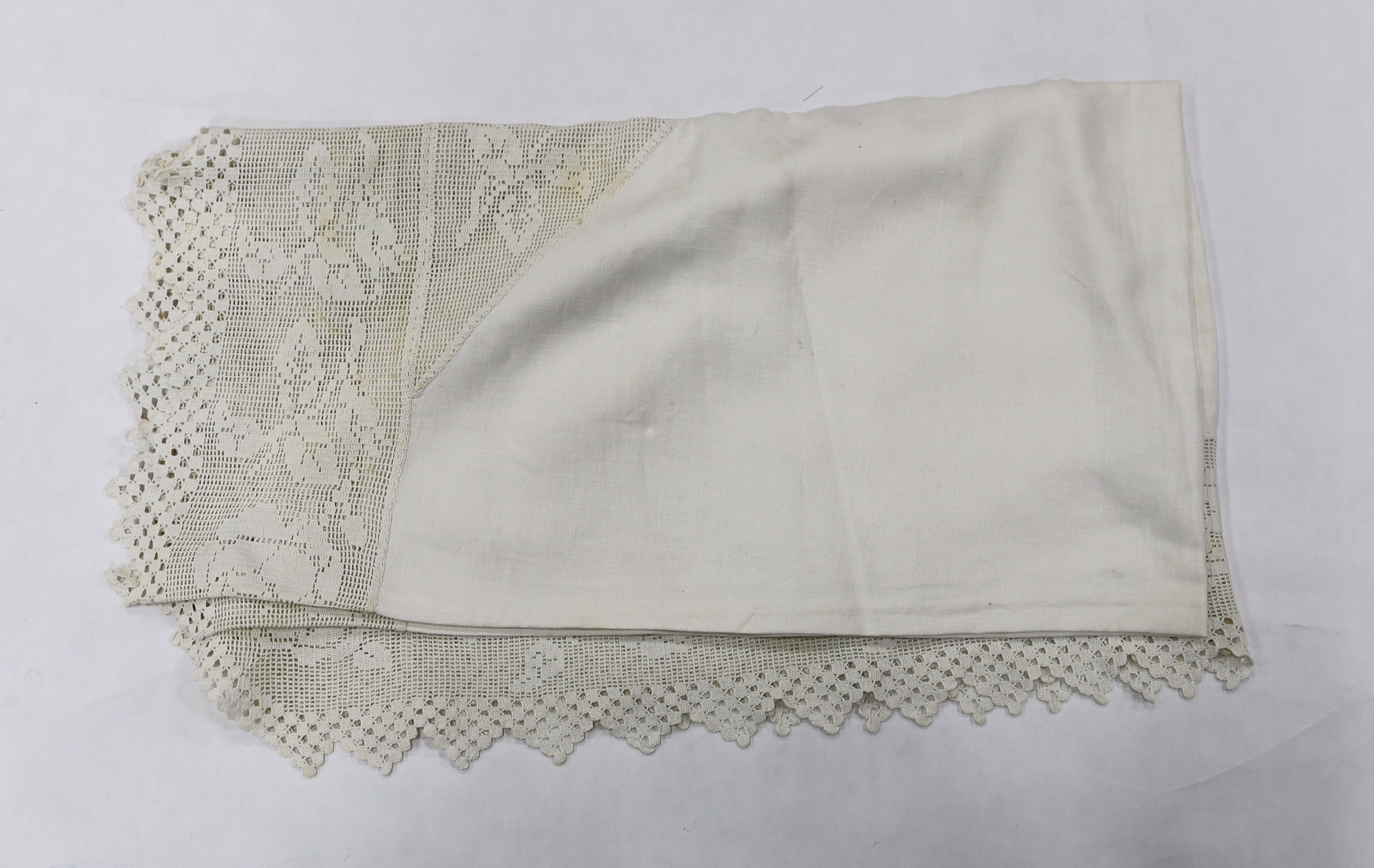 A tablecloth with a wide crocheted border and a blue and white Japanese panel decorated with mons, Japanese fabric 215cm long x 138cm wide (2)